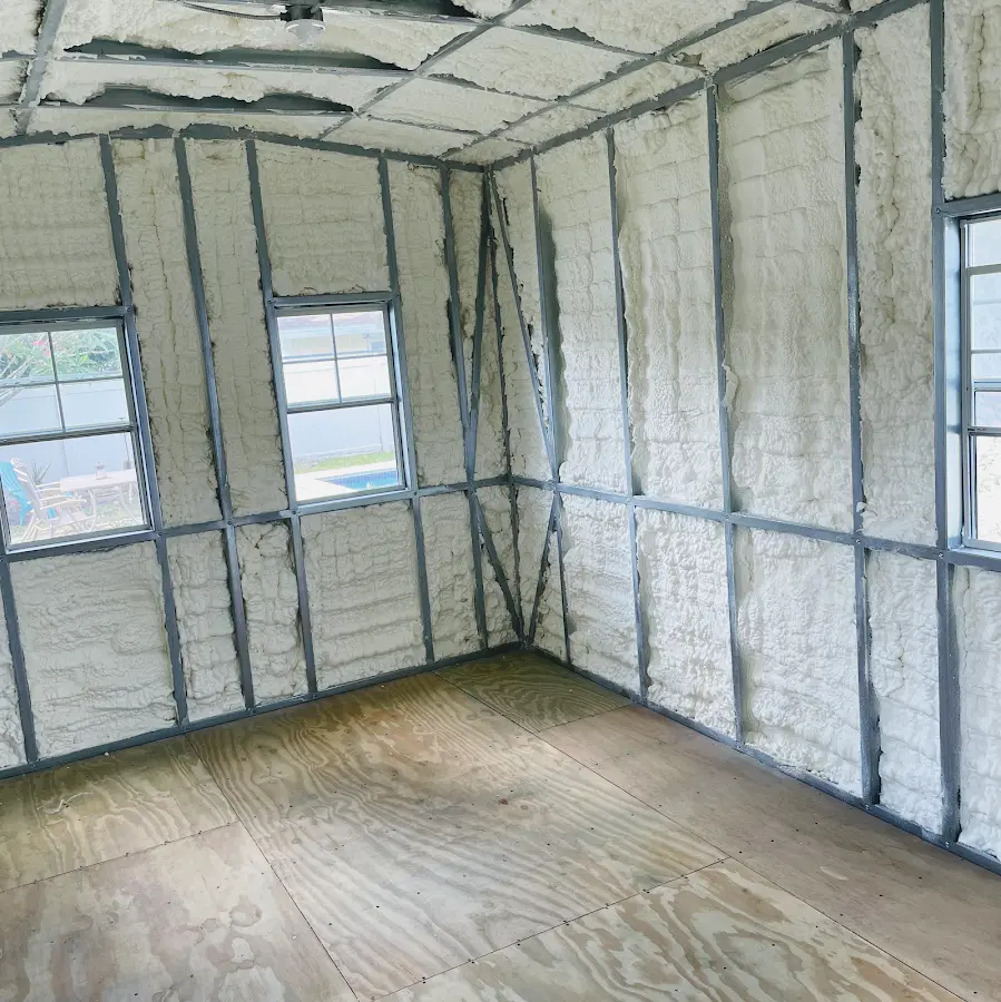 Closed-cell spray foam insulation applied to wall cavities in a residential project in Red Hook